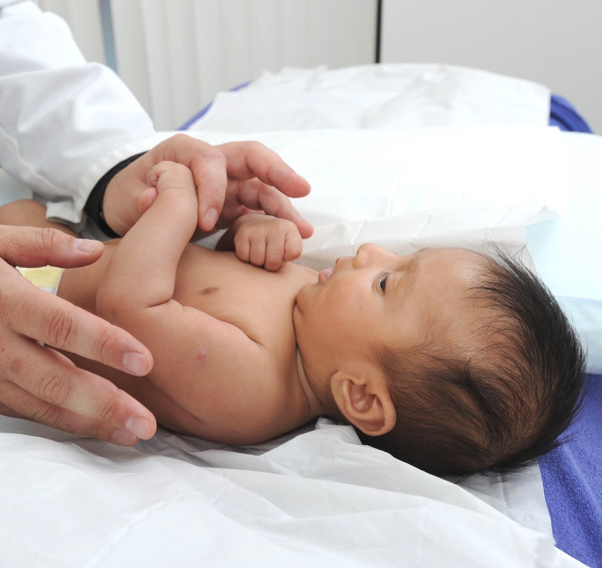 photo of baby receiving treatment for colic